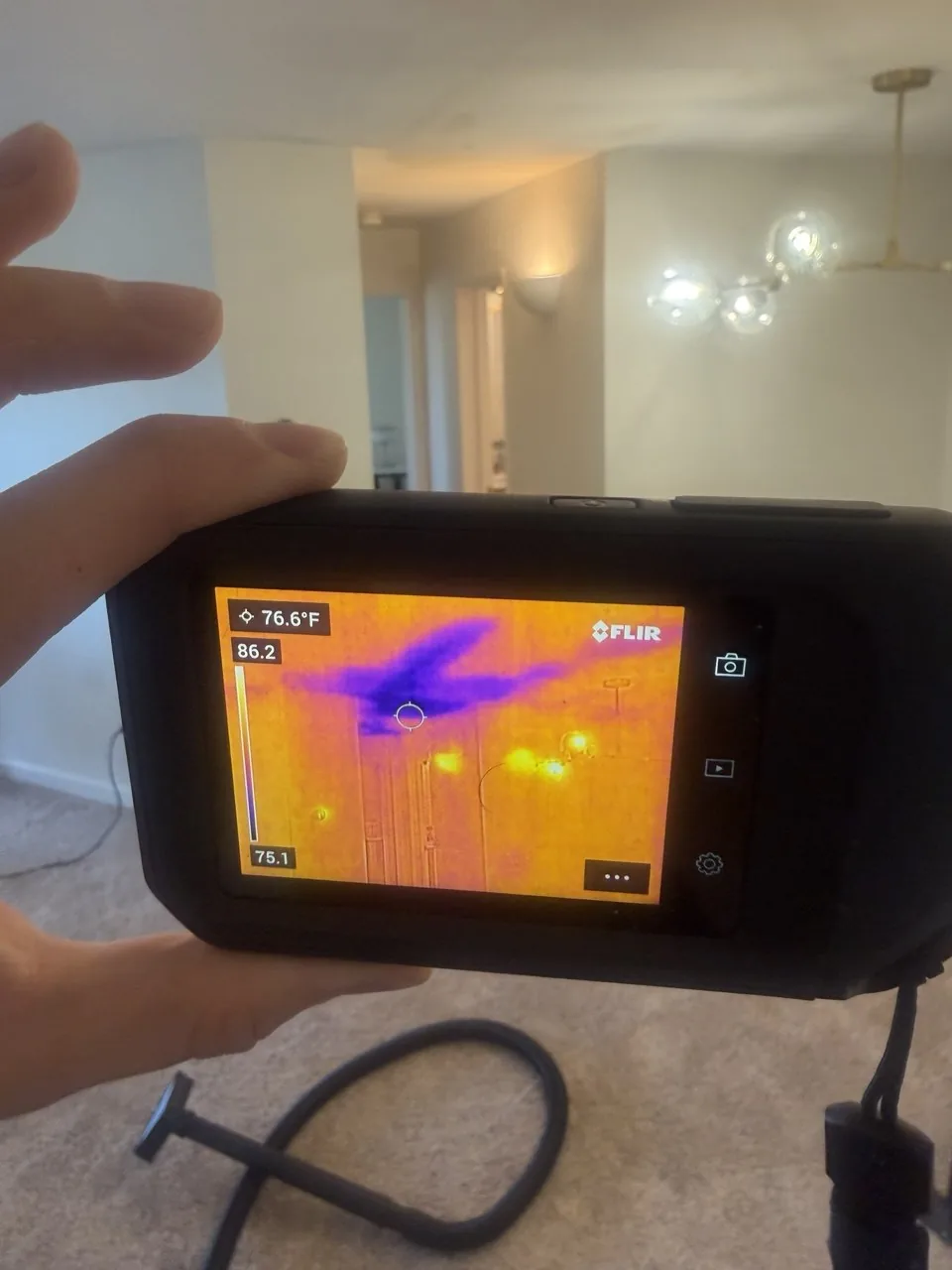 Thermal camera showing a cold wet area spreading across a condo ceiling in Scripps Ranch